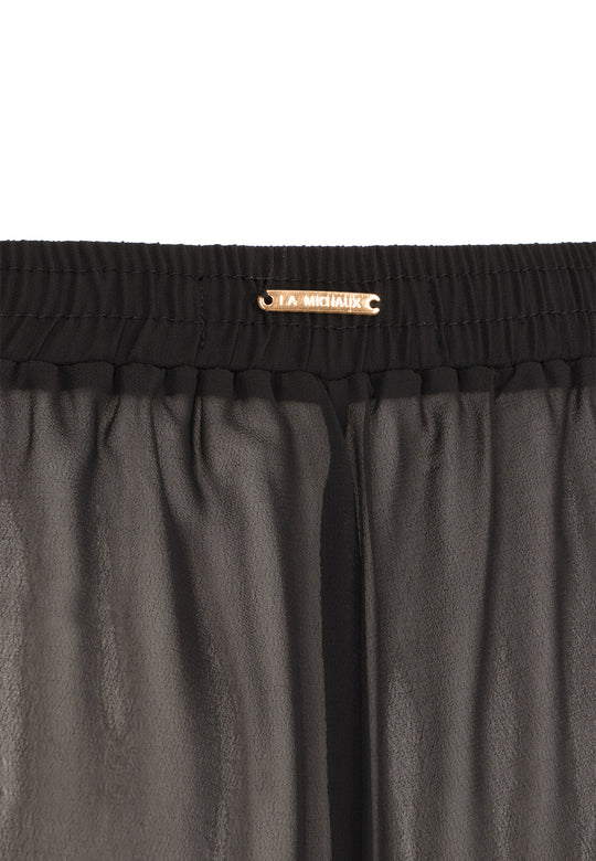 La Michaux women’s black luxury wide-leg beach pants with elastic waistband, front view. #color_black